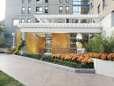 Exterior view of Jack Satter House entrance with flowers
