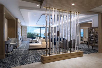 Bright common area with seating and large windows