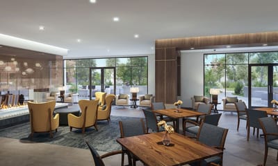 Bright common area with seating and a fireplace