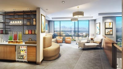 Bright common area with cozy seating and large windows