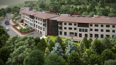 Aerial view of Solera Senior Living facility surrounded by greenery