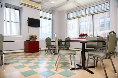 Interior view of a common area with tables and chairs