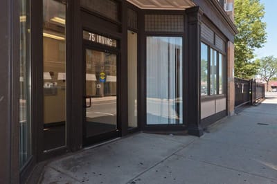 Exterior view of the entrance at Irving Square Apartments
