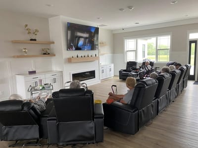 Residents watching a movie together in a common area