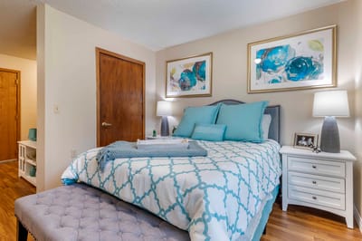 A cozy resident room with bed and decor
