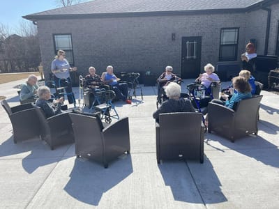 Residents enjoying time outdoors in a garden setting