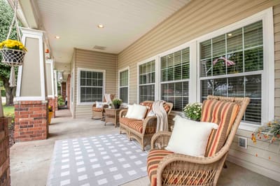 Outdoor seating area with chairs and flowers