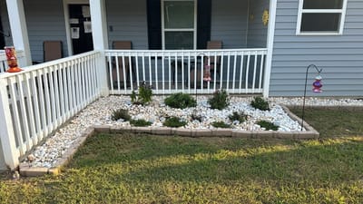 Flower bed with decorative stones in outdoor space