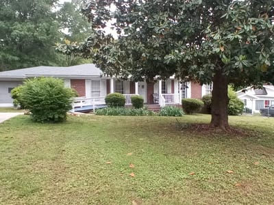 Exterior view of a senior living facility with landscaping