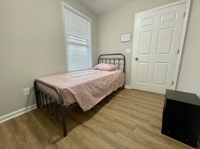 Private resident bedroom with a bed and furniture