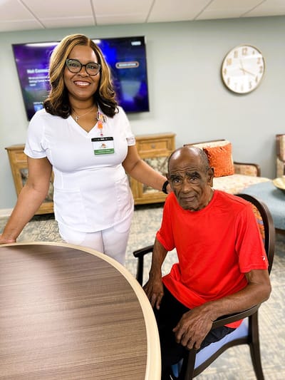 Staff member with resident in a common area