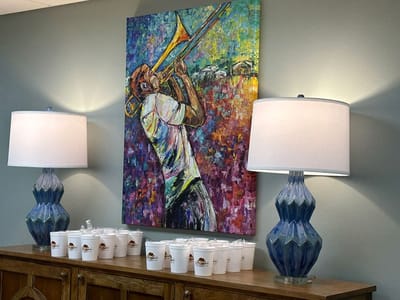 Colorful artwork in a communal space with lamps