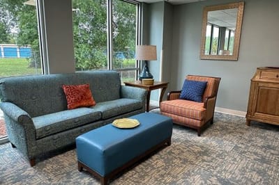 Cozy common area with seating and natural light