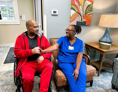Residents and staff interacting in a common area