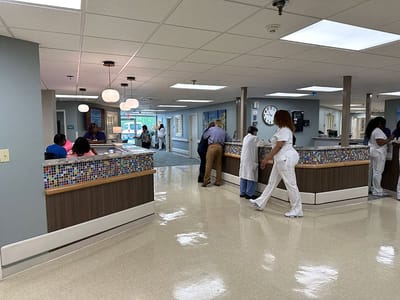 Interior view of a nursing facility with staff and residents
