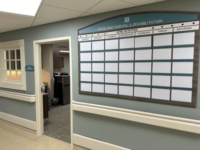 Interior hallway with a activities calendar and office