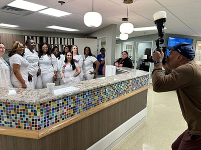 Staff members posing in the facility's common area