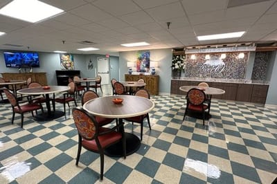 Dining room with tables and chairs in a bright space