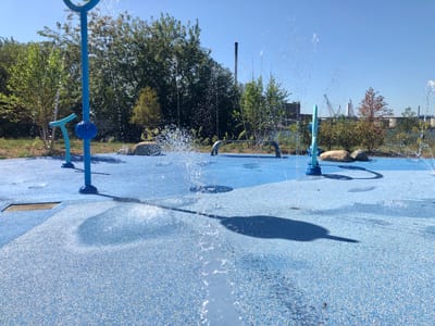 Outdoor splash pad area with water features