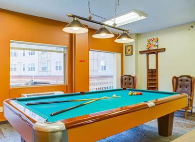 Interior view of a game room with a pool table