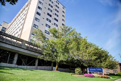 Exterior view of Melville Towers with landscaping
