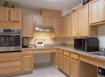 Spacious kitchen area with wooden cabinets