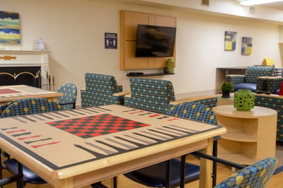 Bright common area with game tables and seating