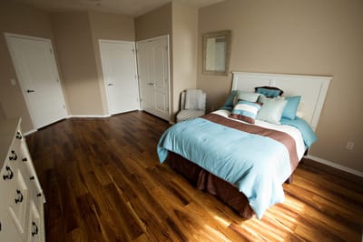 Bright private room with a bed and modern decor