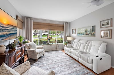 Bright common area with comfortable seating and large window