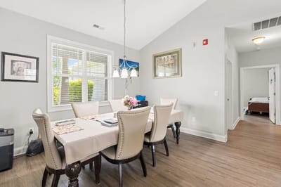 Dining area with a table set for residents