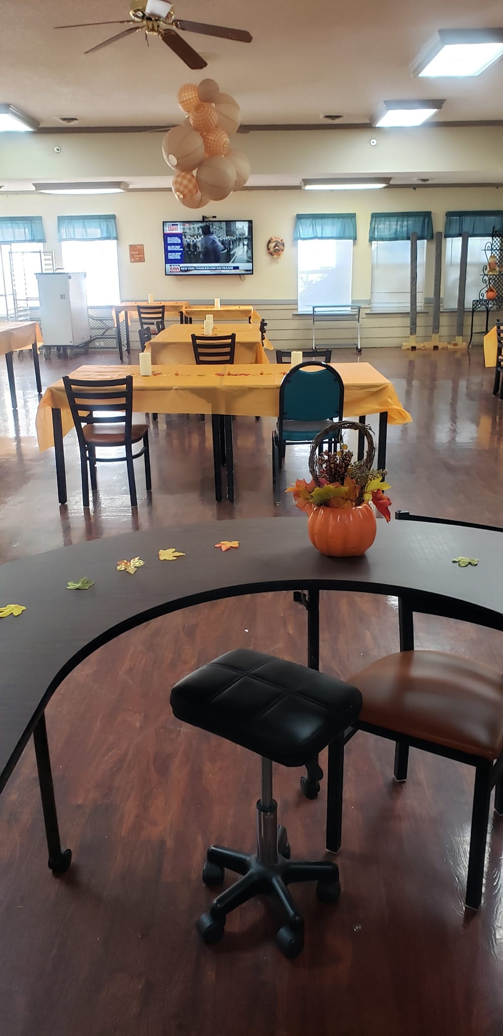 Common area with tables and chairs, decorated for autumn