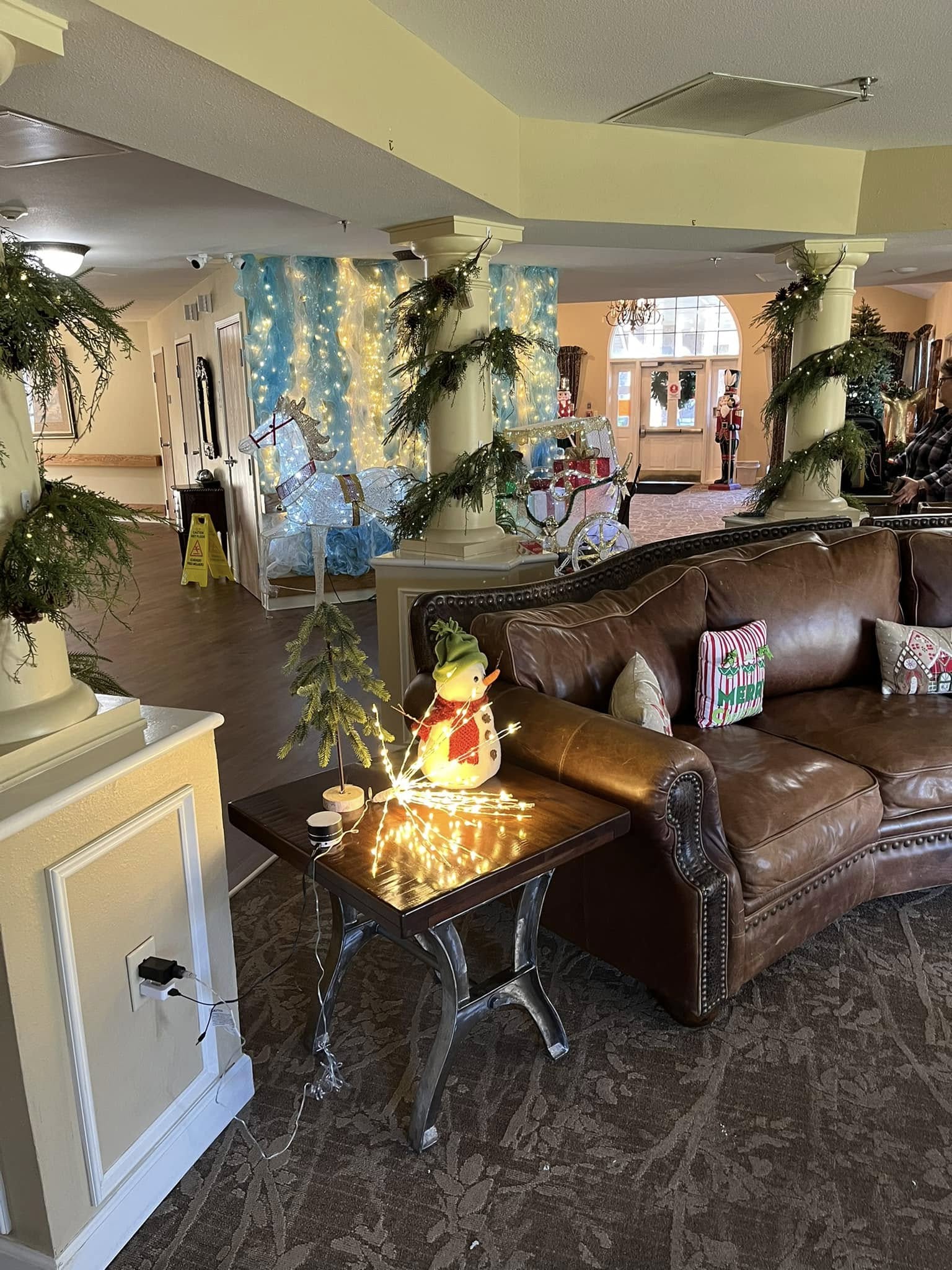 Festively decorated common area with seating