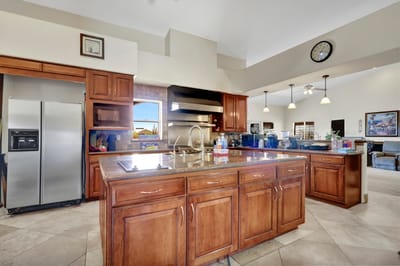 Bright kitchen area with wooden cabinets and granite countertops