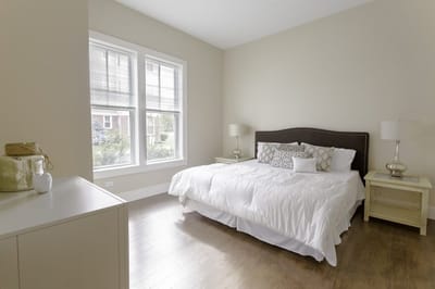 Bright, modern bedroom with large windows