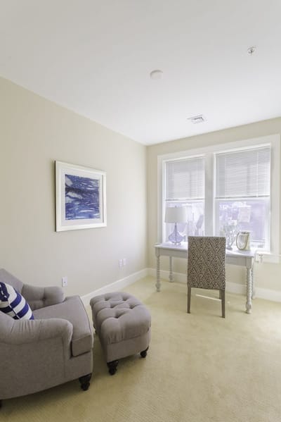 Cozy interior space with a chair and desk.