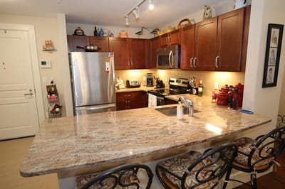 Modern kitchen area with a granite countertop
