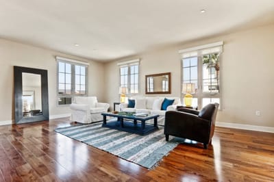 Bright common area with seating and large windows.