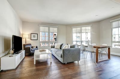 Bright communal living area with sofa and dining table