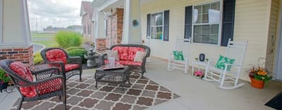 Outdoor seating area with colorful furniture and plants