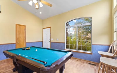 Interior view of a game room with a pool table