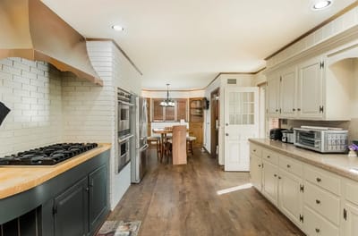 Bright kitchen interior with wood flooring and modern appliances