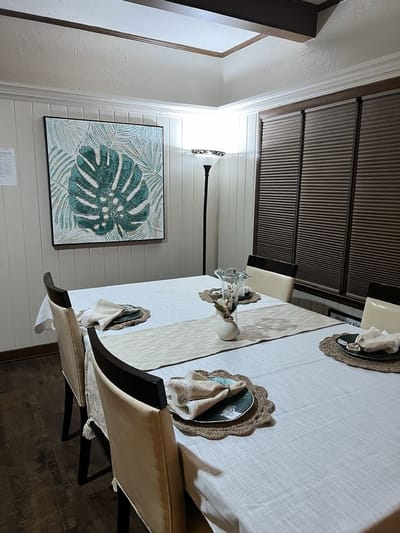 A dining table set with decor in a cozy room