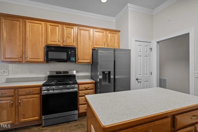 Bright kitchen with wooden cabinets and modern appliances