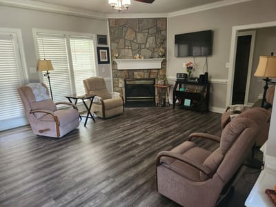 Bright common area with seating and fireplace