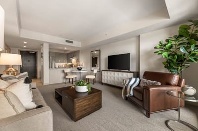 Modern living room with kitchen area in senior facility