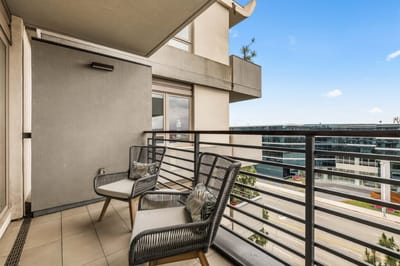 Balcony with chairs overlooking a view