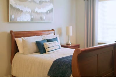 Cozy bedroom setup with a bed and decorative art