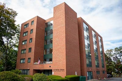 Exterior view of Water Street Apartments building.