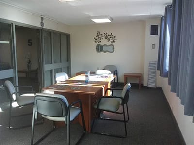 Empty meeting room with a table and chairs