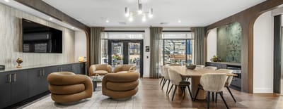 Spacious common area with comfortable seating and dining table